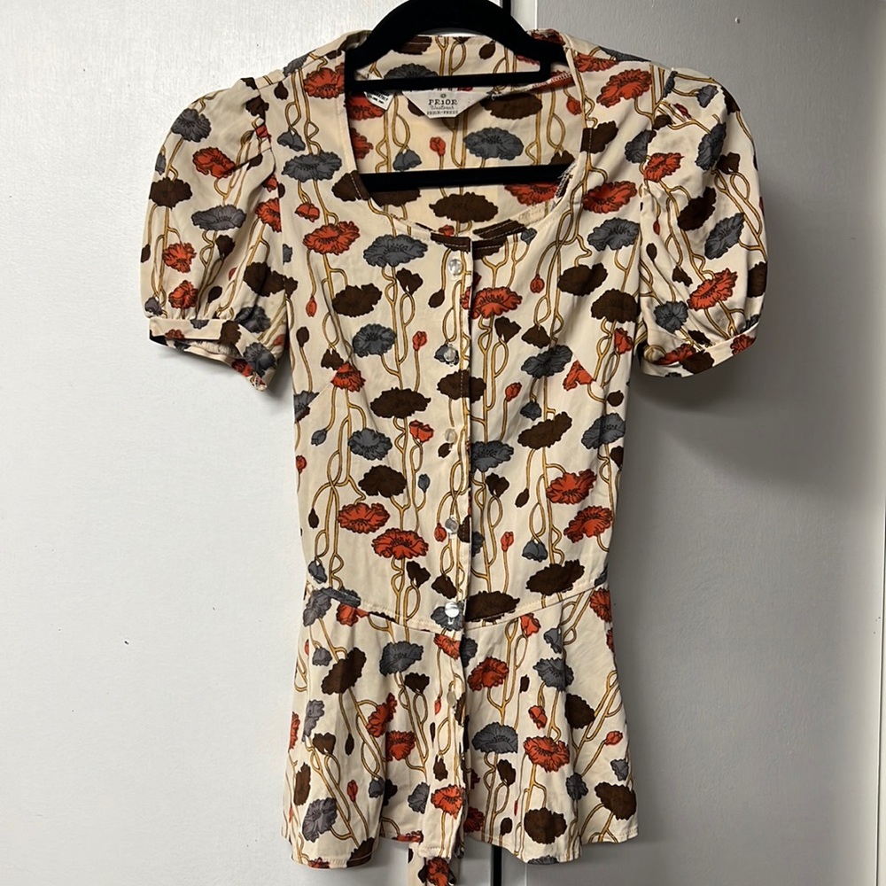Cap sleeve blouse with a bit of a western feel in browns and orange tones.